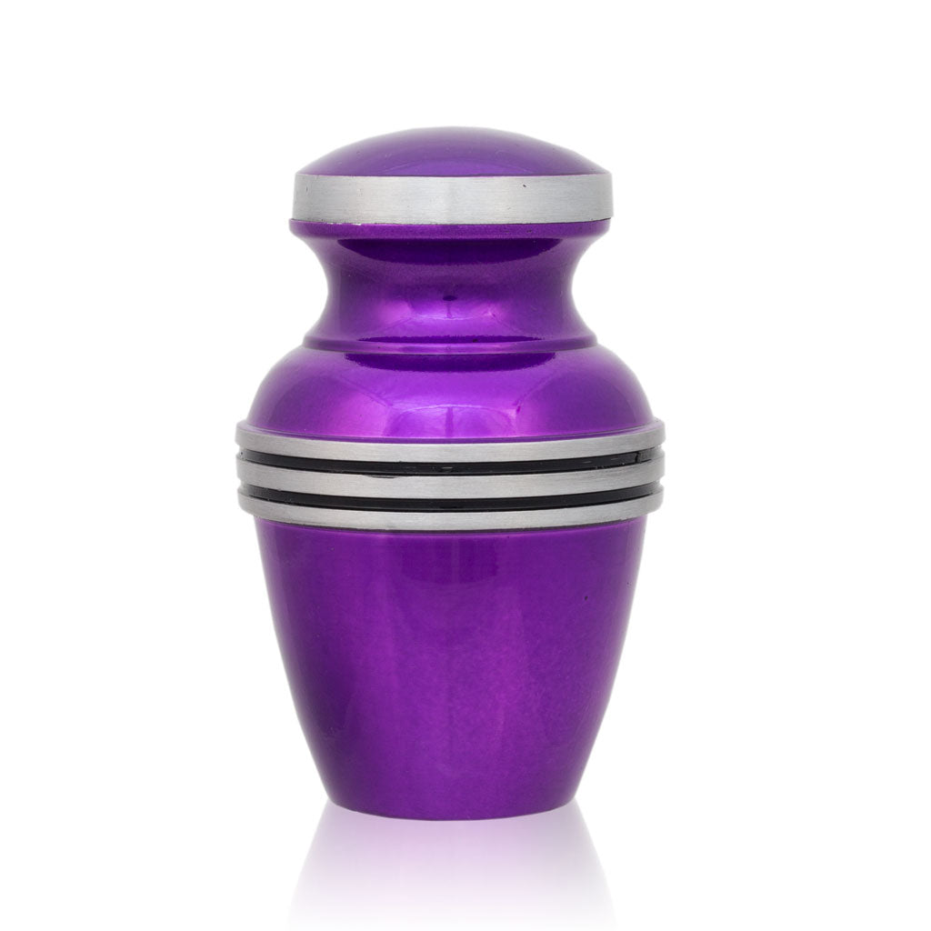 Purple keepsake for cremation ashes with metallic finish and pewter colored trim and accent banding.