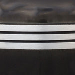 Detail of black painted urn and three pewter toned bands.