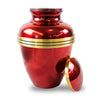 Red 200 pound capacity urn with threaded lid featuring golden colored trim leaning against the side of the urn.
