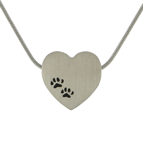 Pewter colored stainless steel pet cremation necklace pendant for ashes in the shape of a heart with two black paw prints on the front.
