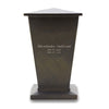 The painted brown resin body back of the urn featuring sample engraved text with loved one's name, years, and message.