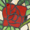 Intricate stained glass cut and stained in the design of a red rose with lead free soldering.