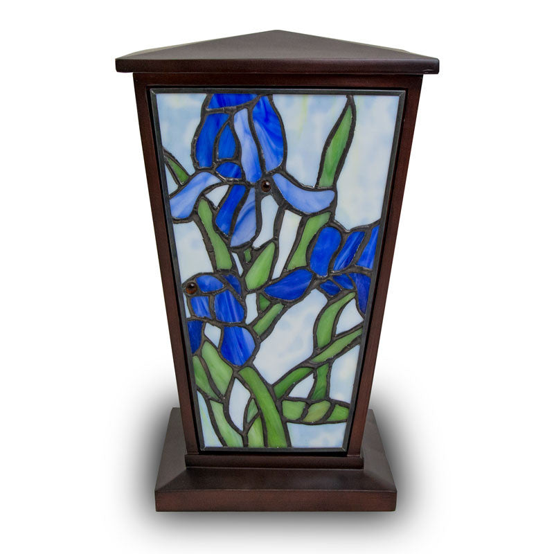 Stained glass urn for ashes with blue iris depicted on front of urn, perfect for up to two-hundred cubic inches of ash.