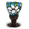 Memory lLamp with white lilies depicted in stained glass with bronze base, used for commemorating a loved one.
