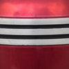 Close view of the red finish and pewter toned trim on the cremation urn.