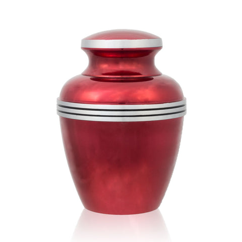 Medium size cremation urn for ashes with metallic red finish and pewter trim.